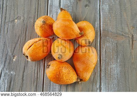 Medlar Ripe, Loquats Fruits Group Of Japanese Orange Fruit Medlars, Exotic, Juicy Sweet Plums On Woo