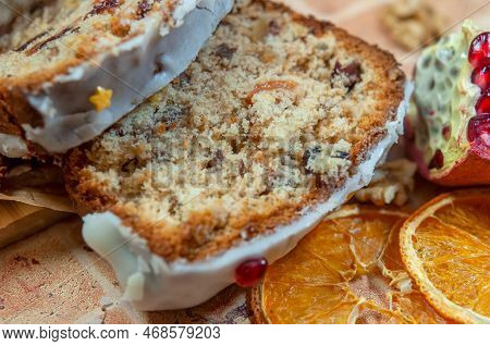 Christmas Stollen With Candied Fruit And Dried Fruits On Parchment. Stollen - Traditional German Bre
