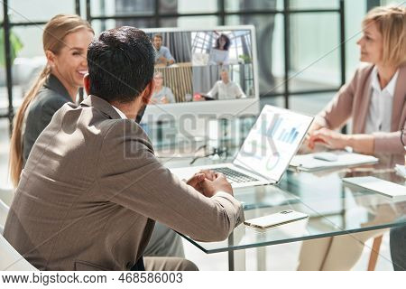 Business Colleagues Discussing Financial Issues Via Video Commun