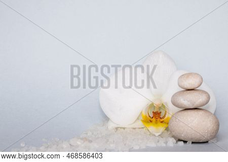 Spa Wellness Concept.pebbles Rocks In Pyramid Sea Salt And Orchid Flower