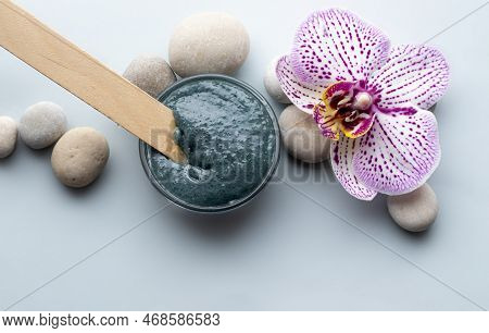 Spa Wellness Concept.pebbles Rocks In Pyramid Sea Salt And Orchid Flower