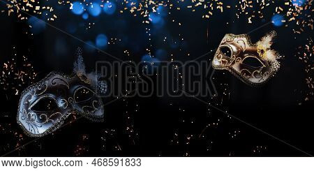 Venetian Carnival Mask On Festive Background With Golden Confetti And Blue Bokeh.