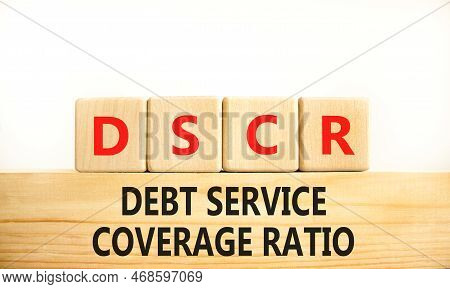 Dscr Debt Service Coverage Ratio Symbol. Concept Words Dscr Debt Service Coverage Ratio On Wooden Bl