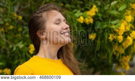 Portrait Of Happy Beautiful Bearded Girl, Young Positive Woman With Beard Is Smelling Beautiful Yell