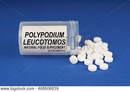 The Concept Of Pharmacology And Health. On A Blue Surface Are Pills And A Dusty Jar With The Inscrip