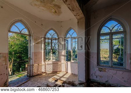 Old Shabby Room Of Abandoned Mansion In Gothic Style.