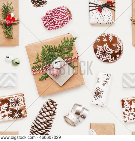 Photo Seamless Pattern With Christmas Presents And New Year Decorations. Top View On Gift Boxes In C