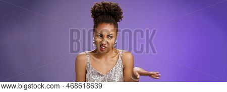 Arrogant Peeky African-american Woman In Shiny Luxurious Dress Cringing Aversion Wave Away Dislike A