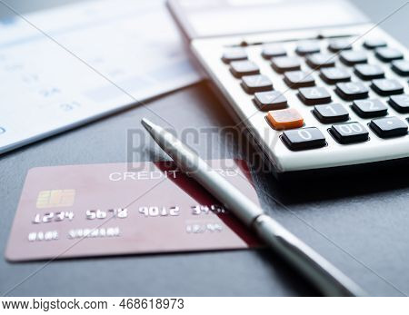 Calculator With Blur Calendar Paper And Credit Card,pen On Table,data Business Finance Growth Invest