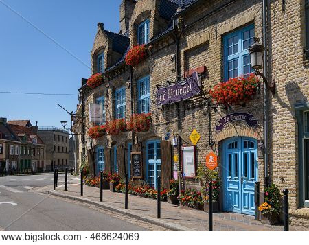 Bergues, France - July 5. 2022: An Old Traditional House On A Clear Day In France, Blue Sky, Summer
