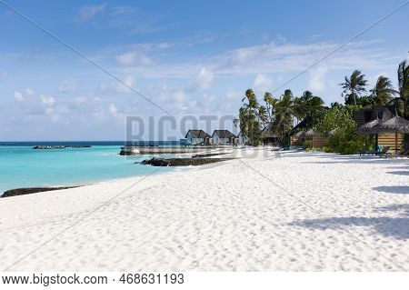 Beach Of A Tropical Island With White Sand And Turquoise Water On The Maledives