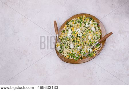 Salad Of Vegetables, Pasta And Mozzarella In A Dish On A Light Background. Top View.