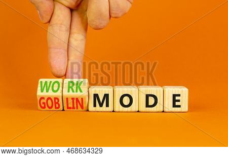 Work Or Goblin Mode Symbol. Concept Word Work Mode Goblin Mode On Wooden Cubes. Businessman Hand. Be