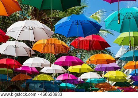 Colorful Umbrellas Spanning Street At Caudan Waterfront Shopping Center, Port Louis, Mauritius