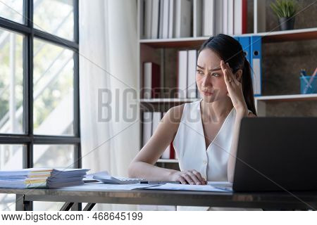 Young Business Asian Women Are Stressed While Working On Laptop, Tired Asian Businesswoman With Head