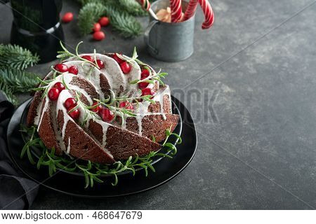 Christmas Chocolate Bundt Cake. Traditional Christmas Fruit Cake With White Glaze, Cranberries And R