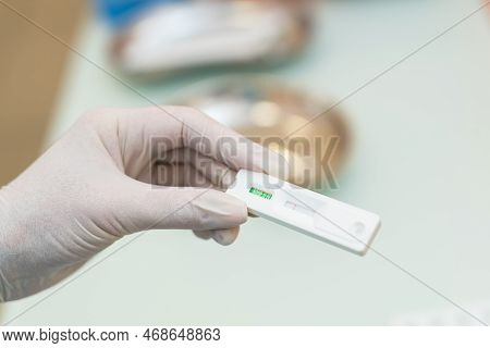 Hands Of Laboratory Assistant In Gloves Analyzing Blood Sample. Prevention. Pneumonia Diagnosing. Co