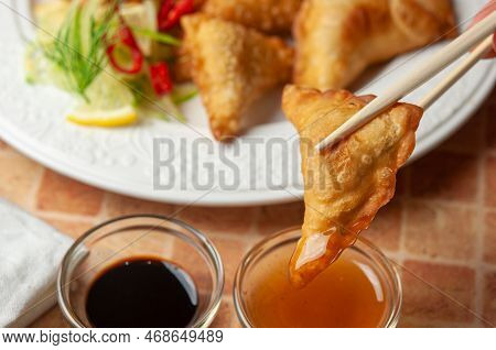 Chinese Wontons With Sweet Chilli Dip Sauce And Chop Sticks Asian Fried Dumplings With Soy Sauce On 