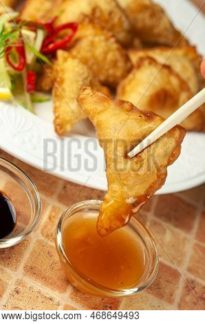 Chinese Wontons With Sweet Chilli Dip Sauce And Chop Sticks Asian Fried Dumplings With Soy Sauce On 