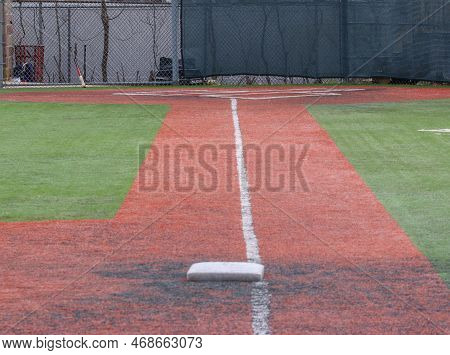 Looking Down The White Foul Line From Third Base To The Batter Box Of A Turf Baseball Field