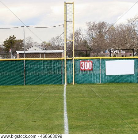 Looking Down The Third Base Foul Line To The Foul Pole 300 Yards Away On A Grass Baseball Field.