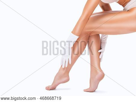 Slender, Beautiful Legs Of A Woman. Hair Removal Procedure On A Woman's Body. Medical Inspection And