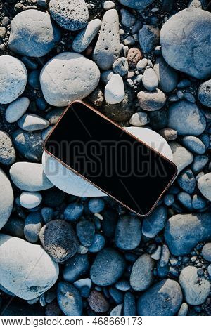 A Phone On A Leaf Of A Summer Tree, A Place For Your Website And Advertising. Summer Mokup On The Be