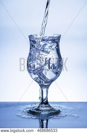 The Image Of Pouring Drinking Water, Into A Broken Glass, That Makes One Feel Refreshed On Blurred W