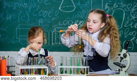 If At First You Dont Succeed Try Another Experiment. Small School Children Holding Test Tubes For La