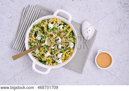 Salad Of Vegetables, Pasta And Mozzarella In A Dish On A Light Background. Top View.