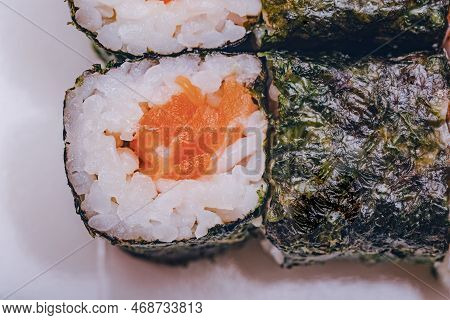Rolls With Salmon. Rice Rolls Salmon Algae Nuri Macro Photo. Photo Of Food.