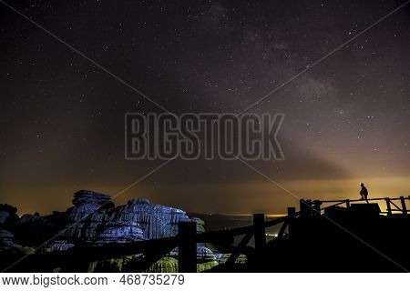 Starry Sky Background At Night In El Torcal De Antequera Natural Park, Andalusia, Spain. Some Of Lig