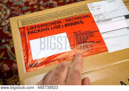Paris, France - Dec 13, 2022: Customer Hand Pointing To The Red Packing List Lieferschein Rechnung R