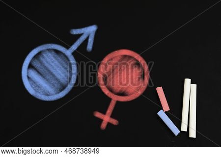 Sex Education. Pieces Of Chalk, Drawn Female And Male Gender Signs On Blackboard, Top View