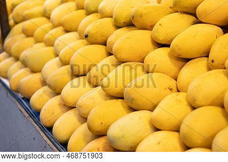 Fruit Market In Thailand, A Counter With Yellow Ripe Mango. Fruits All Year Round.
