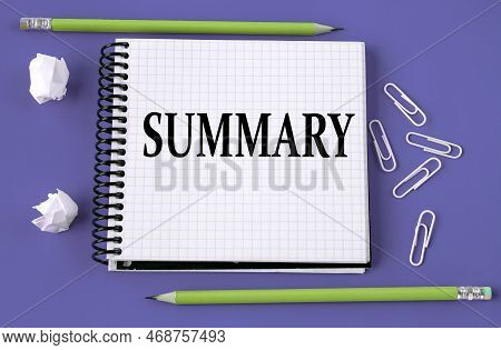 Summary - Word On A White Piece Of Paper On A Black Notebook With A Pen And Glasses. Business Concep