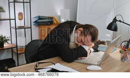 Bored Sleepy Old Businessman Worker Working On Laptop Computer, Yawning, Leaning On Hand Falling Asl