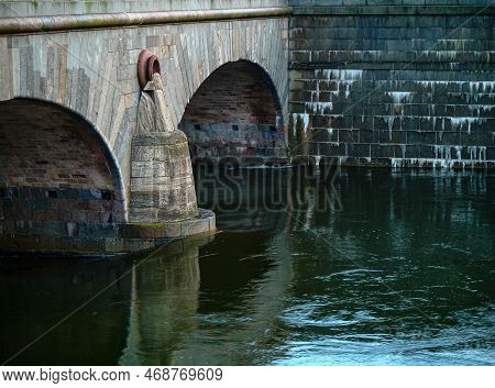 A Old Stone Bridge Over A River