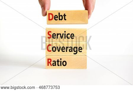 Dscr Debt Service Coverage Ratio Symbol. Concept Words Dscr Debt Service Coverage Ratio On Wooden Bl