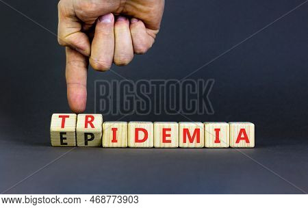 Covid-19 Epidemic Or Tridemic Symbol. Concept Word Epidemic And Tridemic On Wooden Cubes. Doctor Han