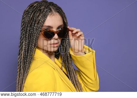 Beautiful Woman With Long African Braids And Sunglasses On Purple Background, Space For Text