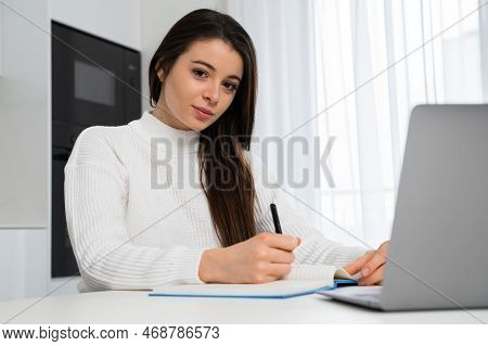 Beautiful Student Enhancing Her Future By Attending Online Lectures.