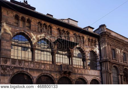 Millan, Italy Loggia Degli Osii 1321 Gothic Style Historical Building Facade In Piazza Mercanti.