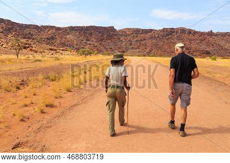 Twyfelfontein, Damaraland, Namibia - 05 October 2018: Tourists In Twyfelfontein, Site Of Ancient Roc