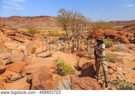 Twyfelfontein, Damaraland, Namibia - 05 October 2018: Tourists In Twyfelfontein, Site Of Ancient Roc