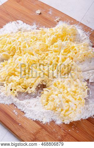 Frozen Grated Butter And Flour. Making Chopped Dough Or Quick Puff Pastry. Baking Ingredients