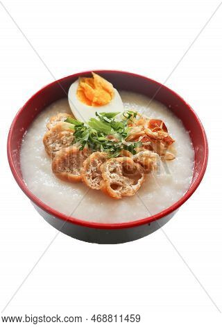 congee porridge with chicken slice, tofu, egg. congee porridge from hong kong. chinese food