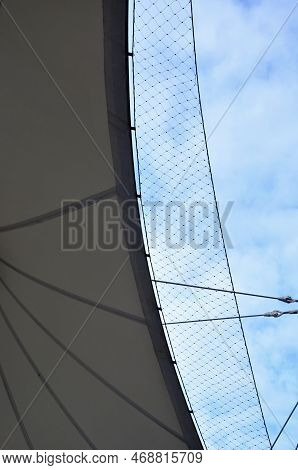White Tarpaulin Taut, Shading From The Sun And Rain Over The Terrace Of The Restaurant, On The Playg