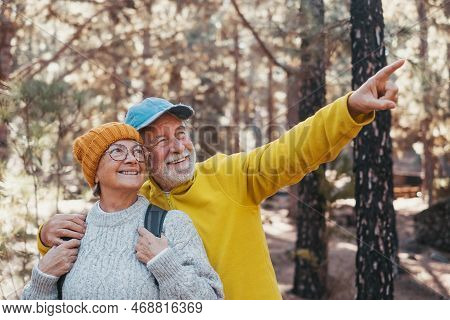 Head Shot Portrait Close Up Of Middle Age Cheerful People Smiling And Looking At The The Trees Of Th