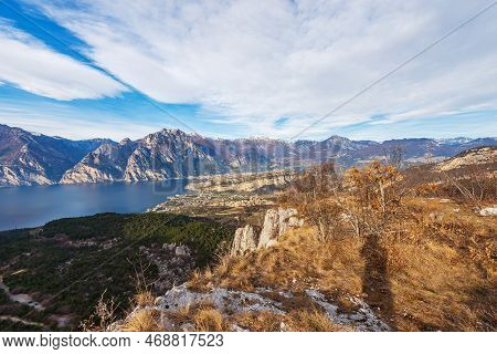 Aerial View Of Lake Garda With The Alps, Dolomites And Sarca Valley, View From The Mountain Range Of
